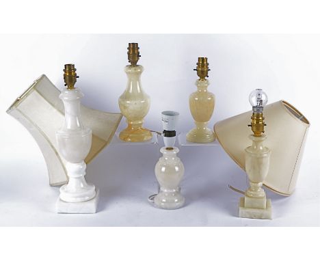 Five contemporary onyx lamps, assorted shapes and sizes, with three cream lampshades and rectangular woven fabric cushion (9)