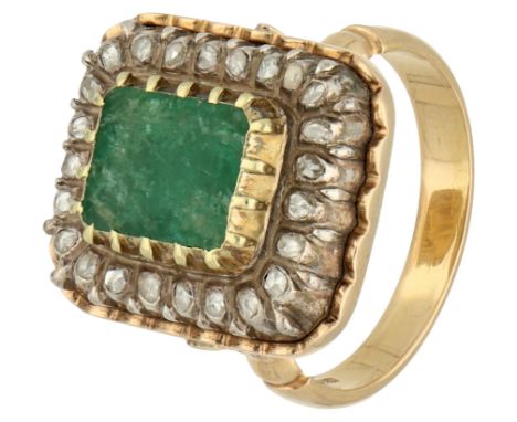 Gold/silver entourage ring set with emerald and diamonds. Set with 24 rose-cut diamonds which are set a silver dense case set