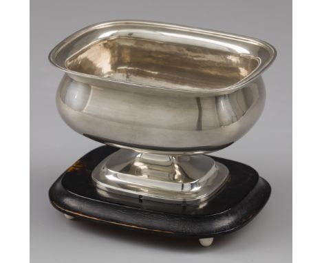 Pipe brazier silver. Beautiful pipe stove on a black wooden platform with a crackled edge. Netherlands, Amsterdam, A. Bonenba
