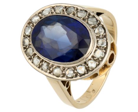 18K Yellow gold entourage ring with synthetic sapphire and rose diamond Set with an oval faceted synthetic sapphire (approx. 