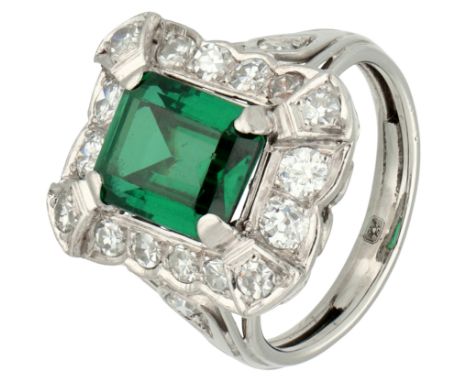 Platinum entourage ring set with a doublet.and approx. 0.54 ct. diamond Set rectangular cut doublet (composite stone of quart