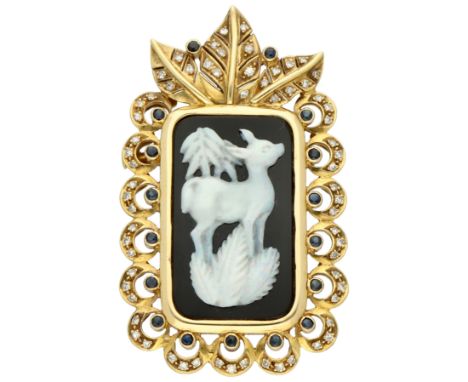 14K Yellow gold multifunctional brooch/pendant set with onyx and opal. The brooch/pendant features a cutout of an opal in the