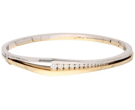 14K Bicolour gold bangle bracelet set with approx. 1.20 ct. diamond. Set with 15 brilliant-cut diamonds totalling about 1.20 