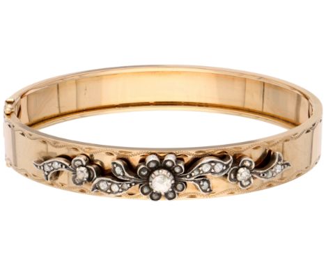 14K Yellow gold bangle bracelet with rose-cut diamonds. Bangle featuring two safety shanks and ornate engravings. The diamond