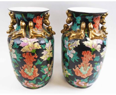 PAIR OF FAMILLE NOIRE VASES, 20th century Chinese ceramic, each decorated flowers and foliage in colours, 36cm H. (2)