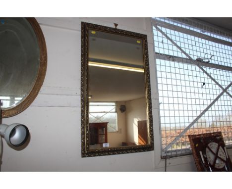 A gilt framed oblong wall mirror