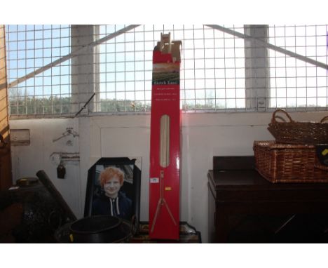 A sketch easel together with a picture of Ed Sheeran
