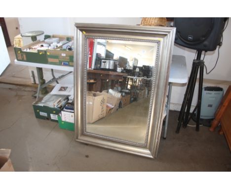 A large oblong bevel edged wall mirror 