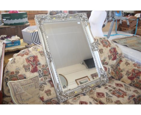 An oblong bevel edge wall mirror