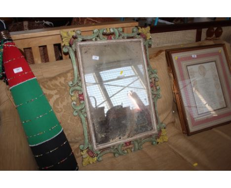 An oblong wall mirror contained in decorative frame