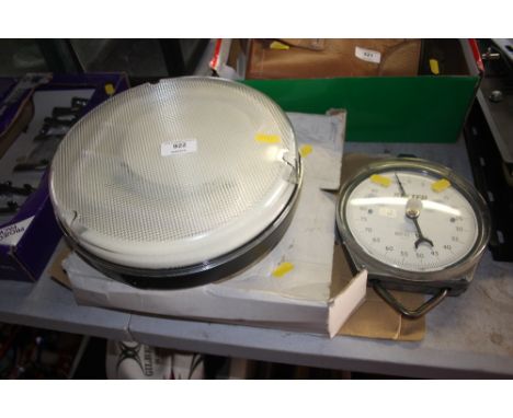 A light fitting together with a set of Salter scales