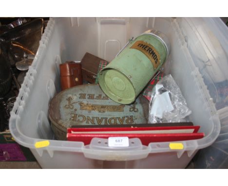 A box containing various sundry items to include Thermos flask, various tins, records etc.