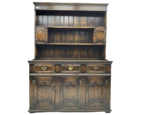Georgian design oak dresser, the two-tier plate rack with two flanking spice cupboards, the base fitted with three drawers ov