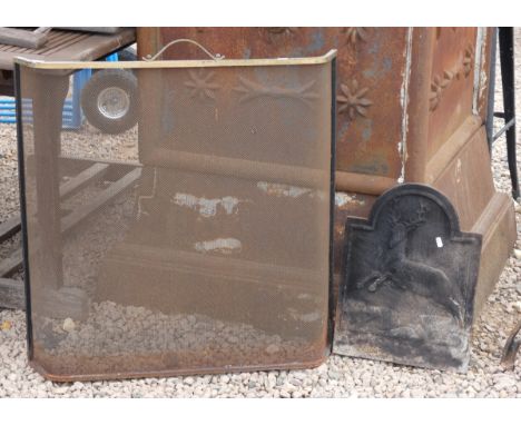 Small cast-iron fire back together with fire screen