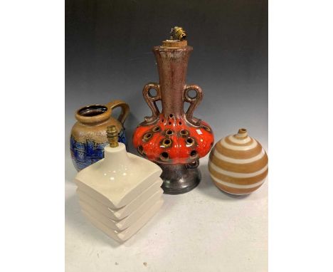 A mid-century earthenware table lamp base, a West German lamp base, a vase, a large black and white plaque and another vase (