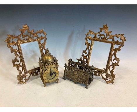 A pair of late 19th/ early 20th century Florentine style gilt metal picture frames with pierced scolling border and impressed