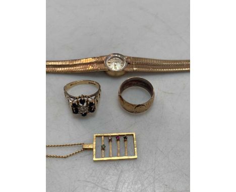 A hallmarked 9ct gold rotary watch, together with two hallmarked 9ct gold rings and a hallmarked 9ct gold pendant on a base m