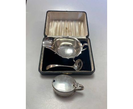 A cased silver sauce boat and ladle, together with a silver mustard, 8.5ozt gross