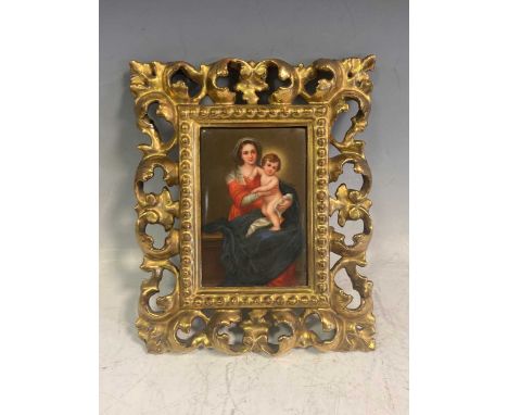 A late 19th/ early 20th century Florentine painted ceramic tile depicting Madonna and child 12 x 8cm, the reverse marked Fire