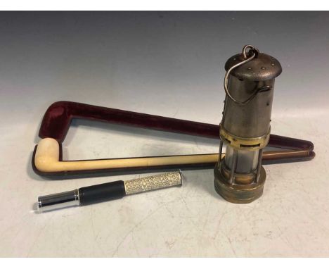 A composite pipe in original case together with a miners lamp and an Otis King calculator