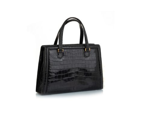 in black crocodile skin leather with brass hardware, stamped HERMÉS PARIS to internal clasp and below, the interior fitted wi
