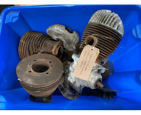 A box of Villiers engine parts including heads and barrels.