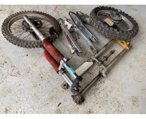 Motocross parts including one set of forks and wheel, one rear wheel, fork stanchions and top and bottom yokes plus two swing