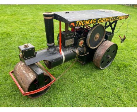 A scale model of a road roller traction engine, runs on an electric motor.