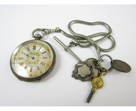A Victorian silver fob watch, the engine turned face set with gilt metal foliage and Roman numerals, in a foliate engraved ca