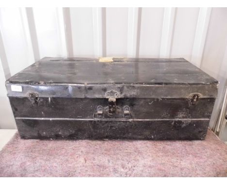 A black enamelled tin trunk