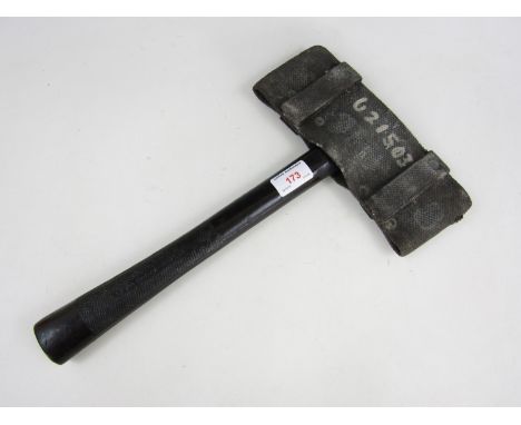 A vintage fireman's axe and carrier
