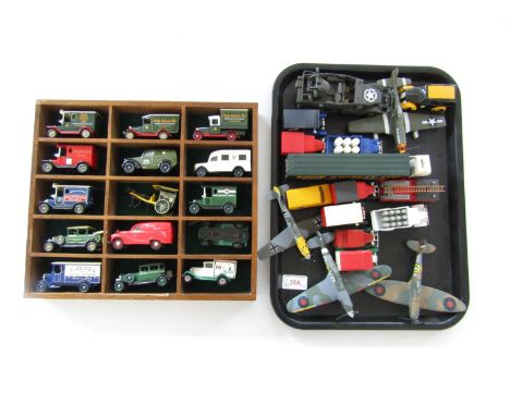 A display shelf containing model cars, vans and aeroplanes