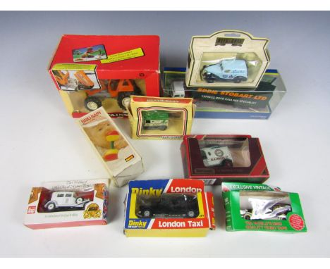 A quantity of boxed die cast cars including a Britains tractor
