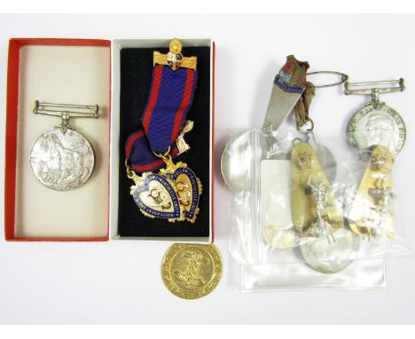 A Second World War Defence Medal and War Medal, together with Royal Signals cap badges, a George V City of Carlisle Silver Ju