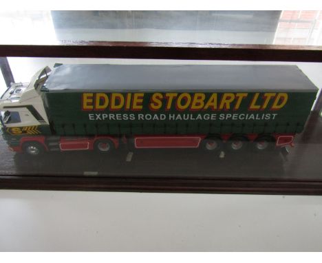 A large-scale hand-built model of an Eddie Stobart articulated lorry, in a glazed display case, model 63 cm 