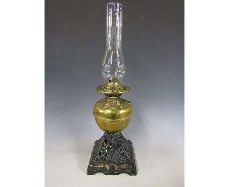 A late 19th Century brass and cast iron oil lamp 