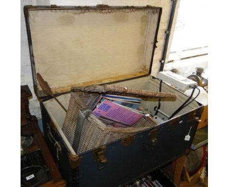 A trunk, a spring scale, petrol can, wicker basket, lamp, etc.
