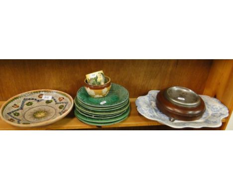 A Victorian blue and white serving plate, green Majolica plates, barometer, etc.