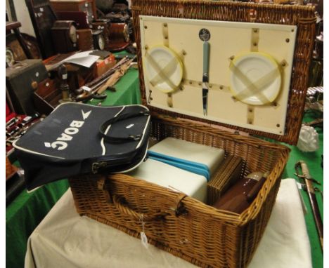 B O A C travel bag and a wicker picnic hamper and contents.