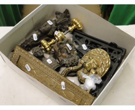 A lion door knocker, letterbox, cast-iron brackets, etc.