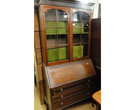 An Edwardian Chippendale design mahogany bureau bookcase.