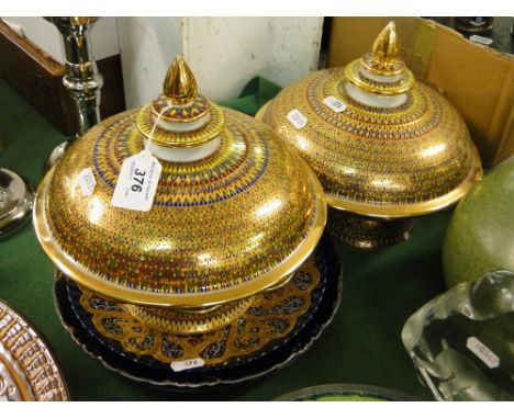 A pair of continental gilded comports, pair of portrait plates and another.