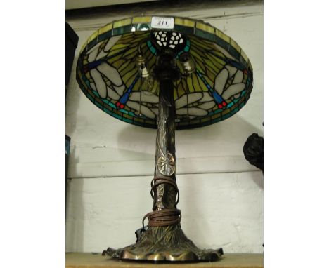 A Tiffany style table lamp with dragonfly design shade.