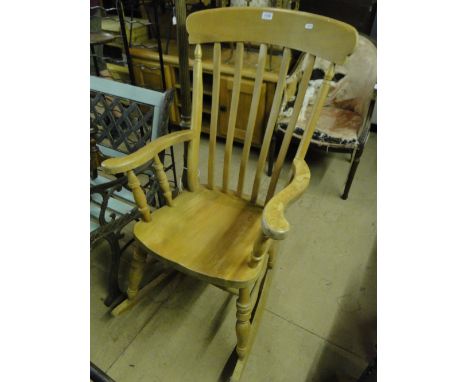 A pine stick back rocking chair.