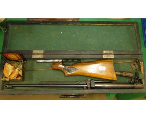 A cased B S A air rifle with tools, etc.