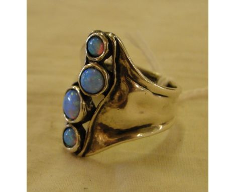 A stylised silver and opal set ring.