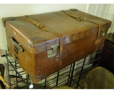 A Vintage travelling trunk with leather mounts by Cave & Sons, Cavendish St.