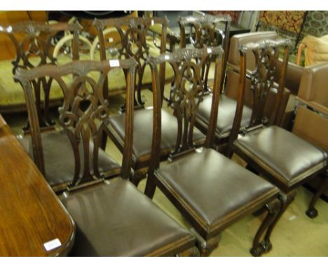 A set of 6 Edwardian mahogany dining chairs in Chippendale style with drop-in seats, claw and ball feet.