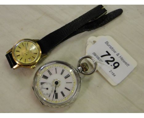 An engraved continental silver lady's fob watch and a lady's Tissot wristwatch.