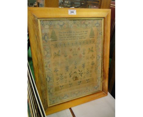 A cross-stitch sampler by Elizabeth Cagill, dated 1825, framed.